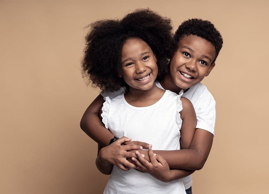 Two children smiling — commercial shoot