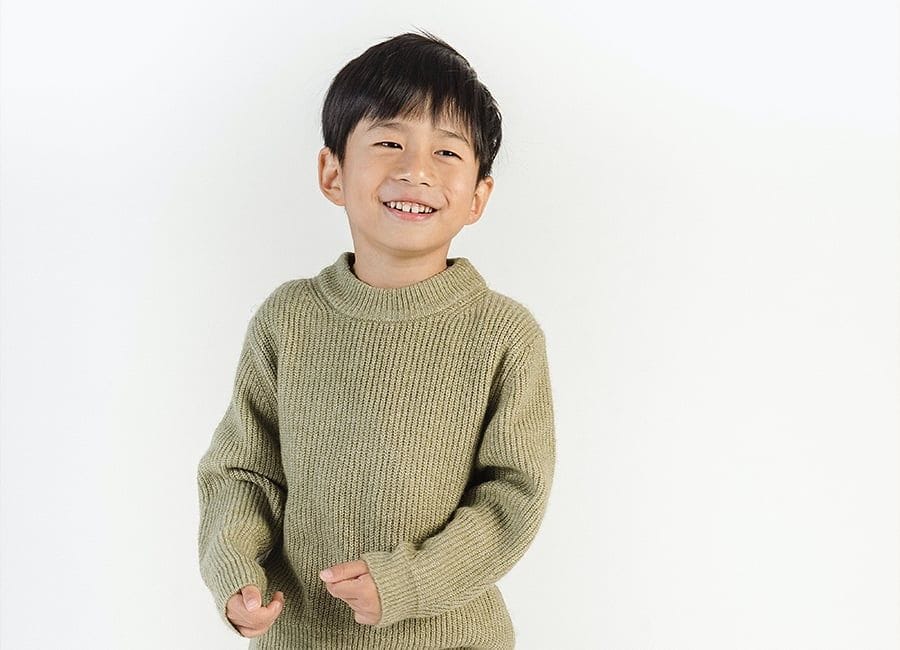 Boy smiling in studio